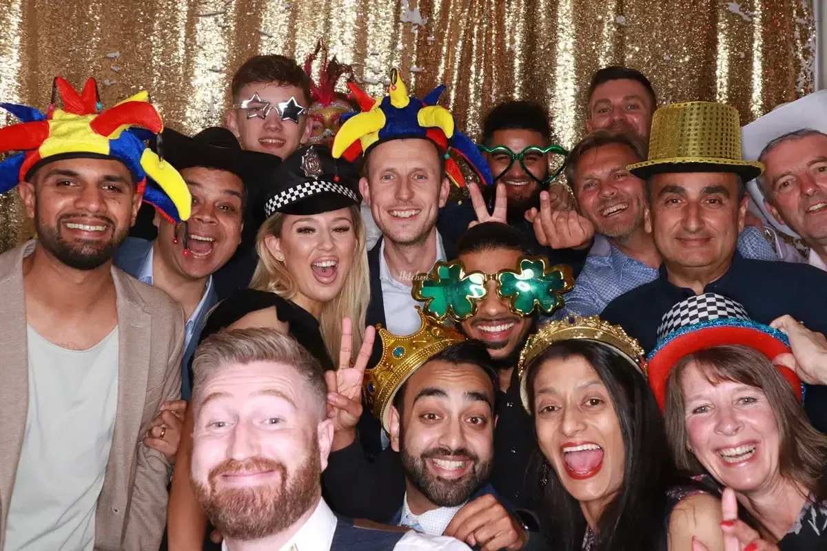 Party guests in colorful hats and glasses
